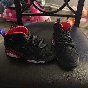 Black/purple and orange kids Jordan’s